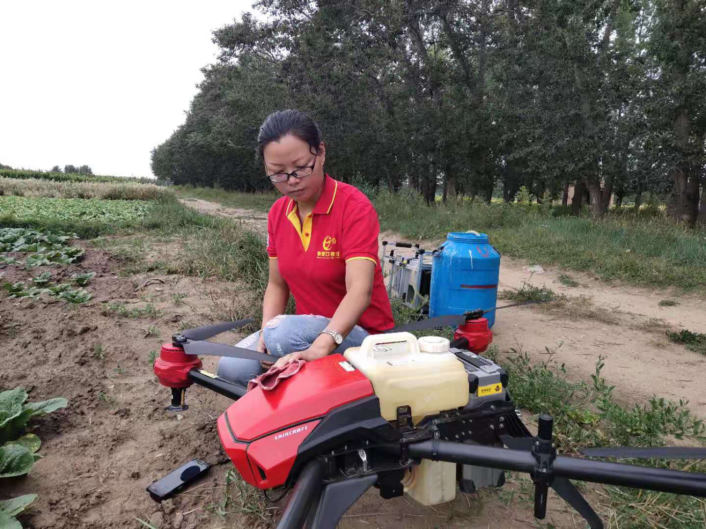 Sheng Guangning and her crop spraying drone