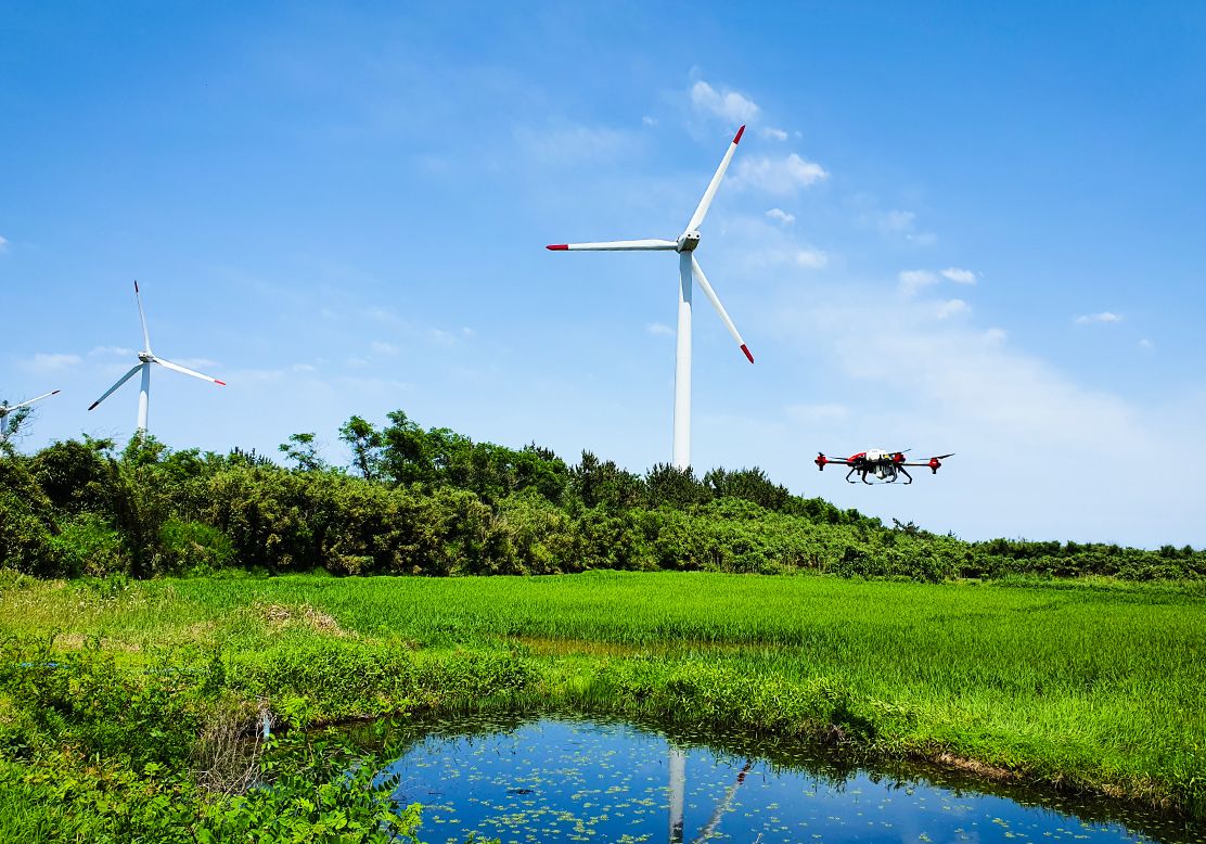  Do you want to know the secret behind this picturesque paddy scene? This organic rice field was experiencing a contamination-free shower from a spray drone with bioagent loaded. Geumodo Island, South Korea. July 2020.