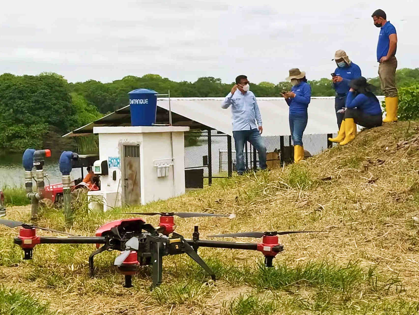 Before working, XAG agricultural drone sits on the slope of cacao plantations