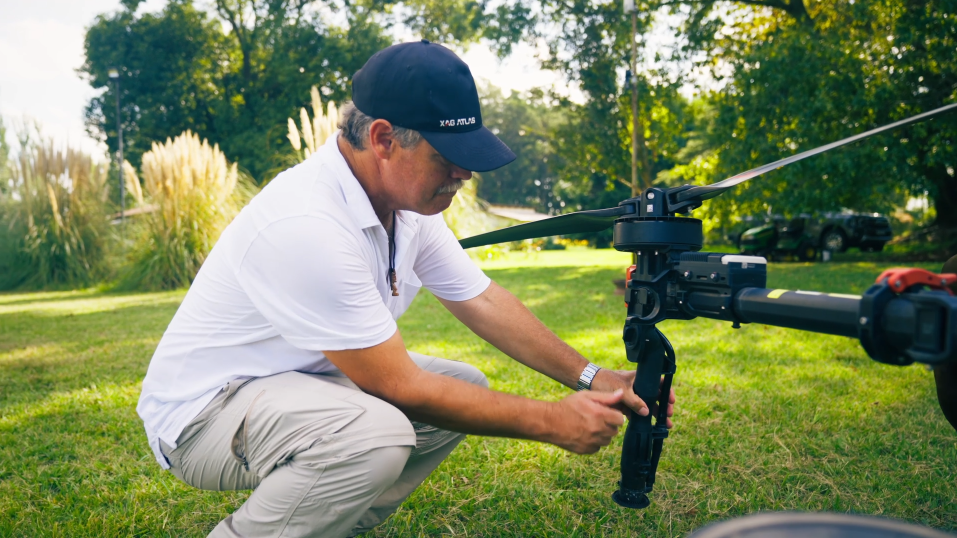 Tomás ajusting the nozzle of XAG P150 agricultural drone